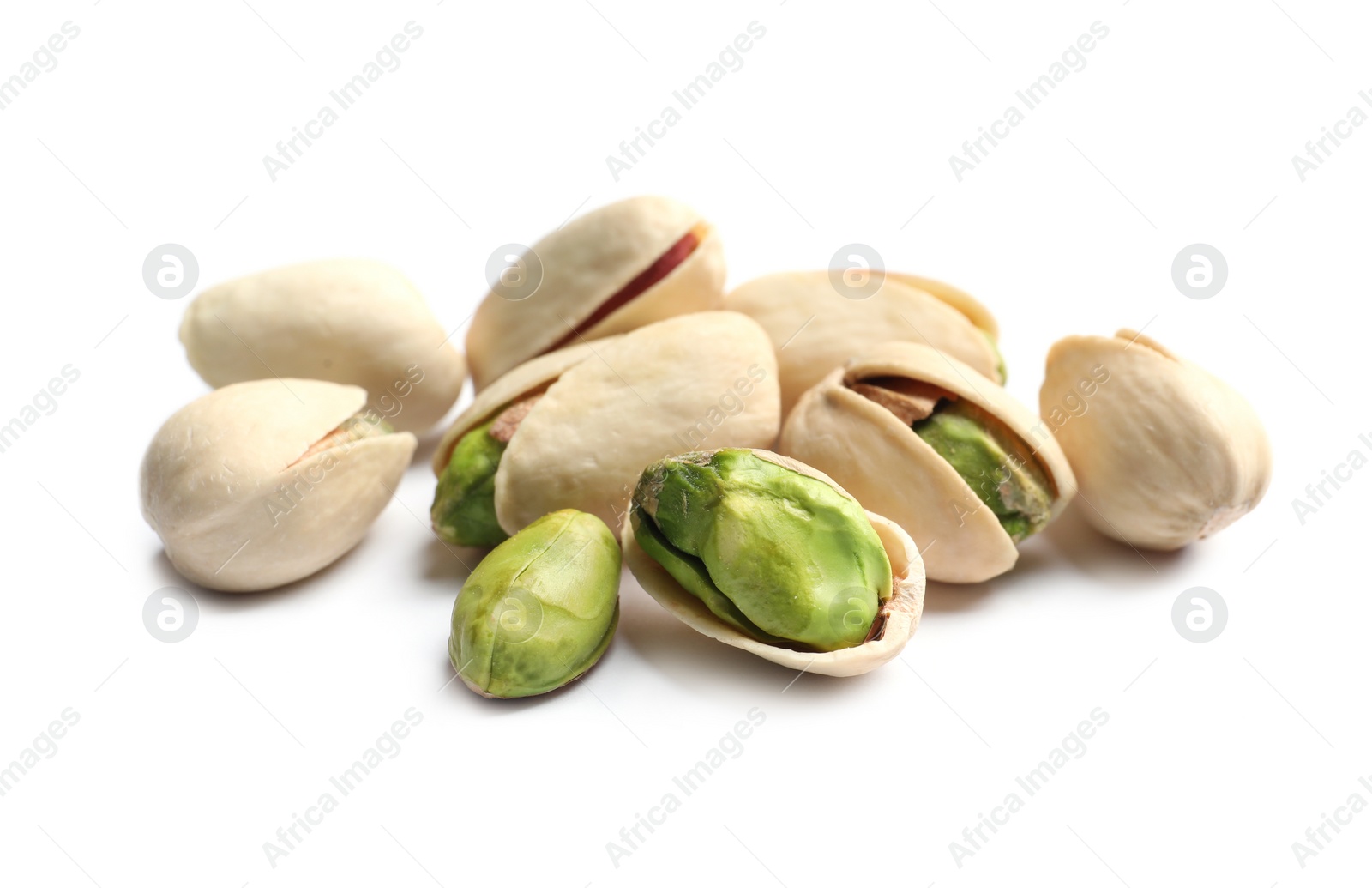 Photo of Tasty organic pistachio nuts on white background, closeup