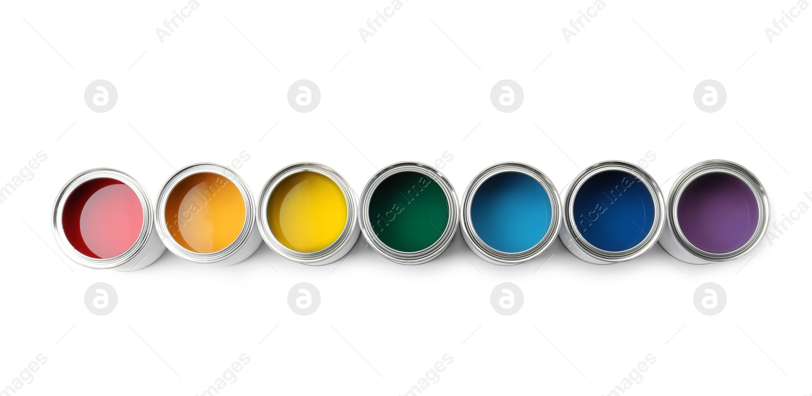 Photo of Row of paint cans on white background, top view