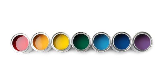 Photo of Row of paint cans on white background, top view