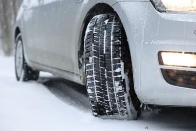Photo of Car with winter tires on snowy road