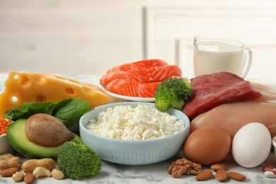 Photo of Different products rich in protein on table, closeup