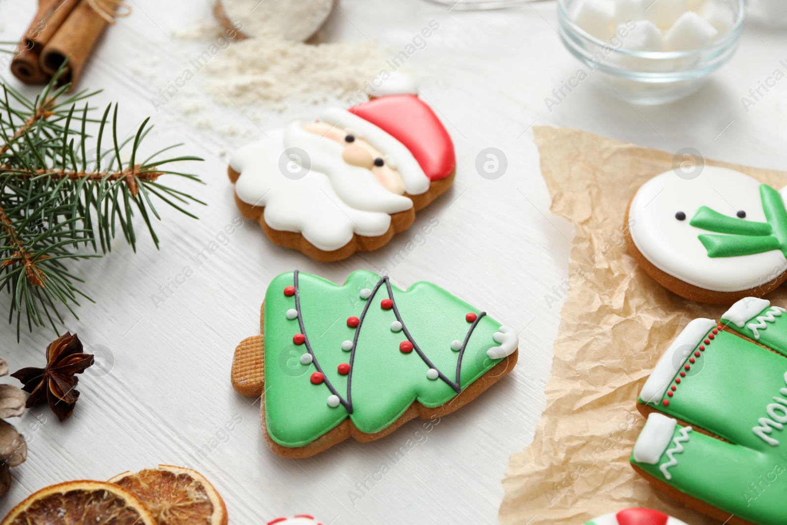 Photo of Delicious homemade Christmas cookies on white wooden table