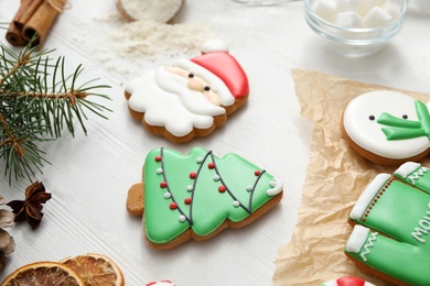 Delicious homemade Christmas cookies on white wooden table