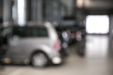 Photo of Blurred view of modern automobile repair shop