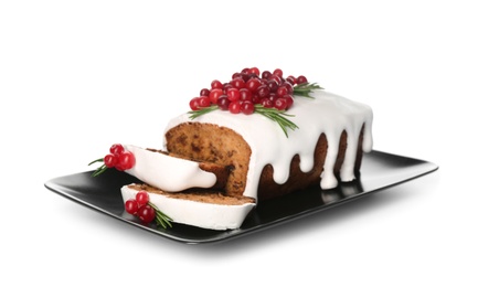 Traditional Christmas cake with cranberries and icing isolated on white. Classic recipe