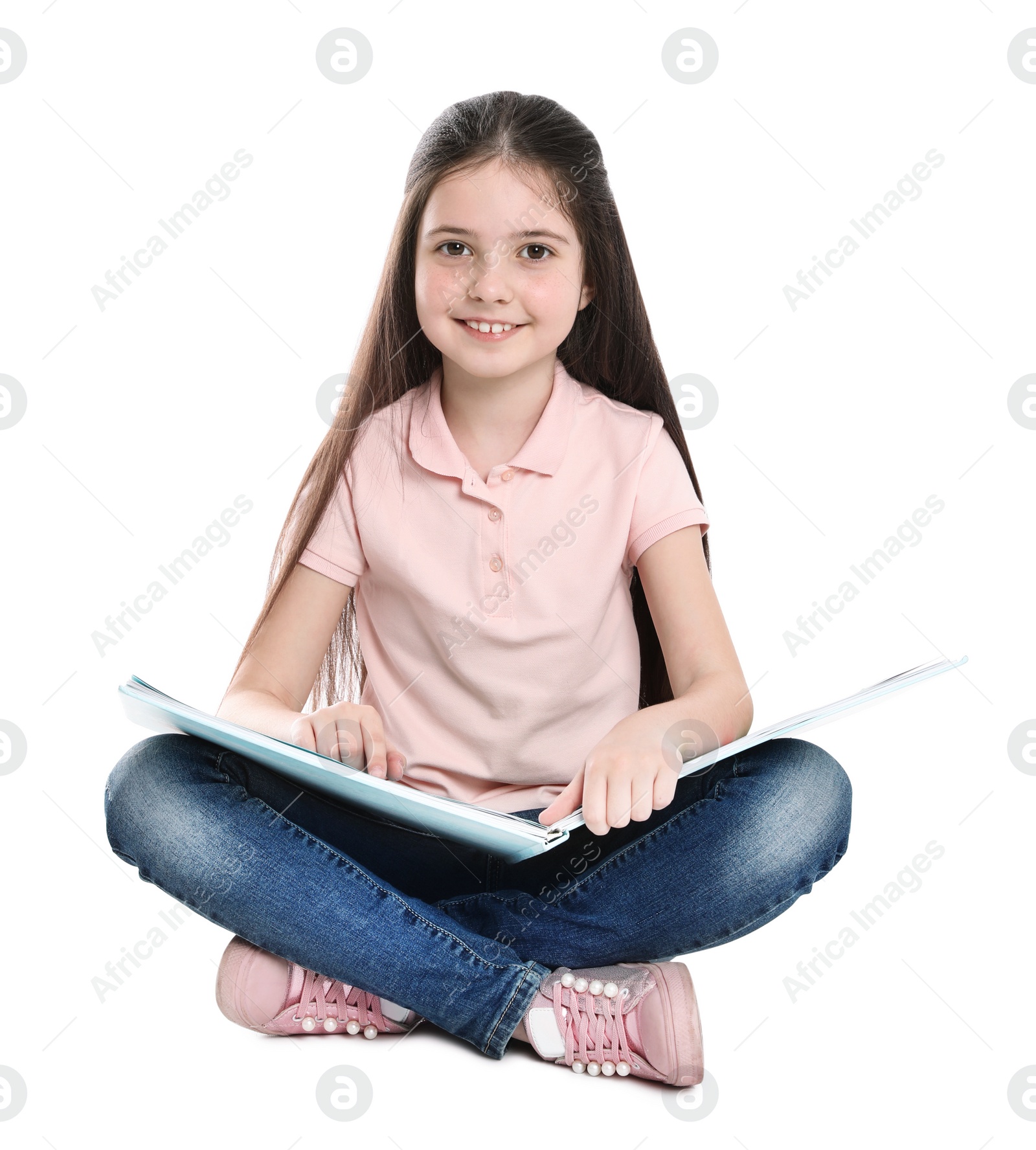 Photo of Cute little girl reading book on white background