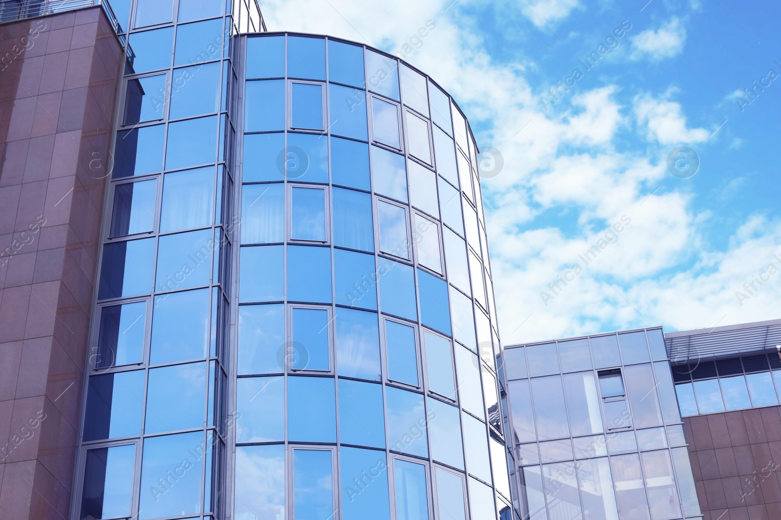 Photo of Building with tinted windows. Modern architectural design