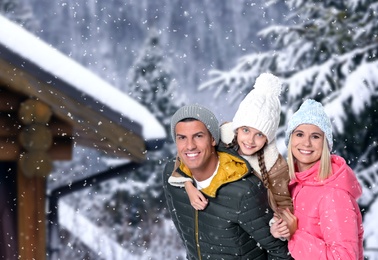 Image of Happy family spending time together at winter resort