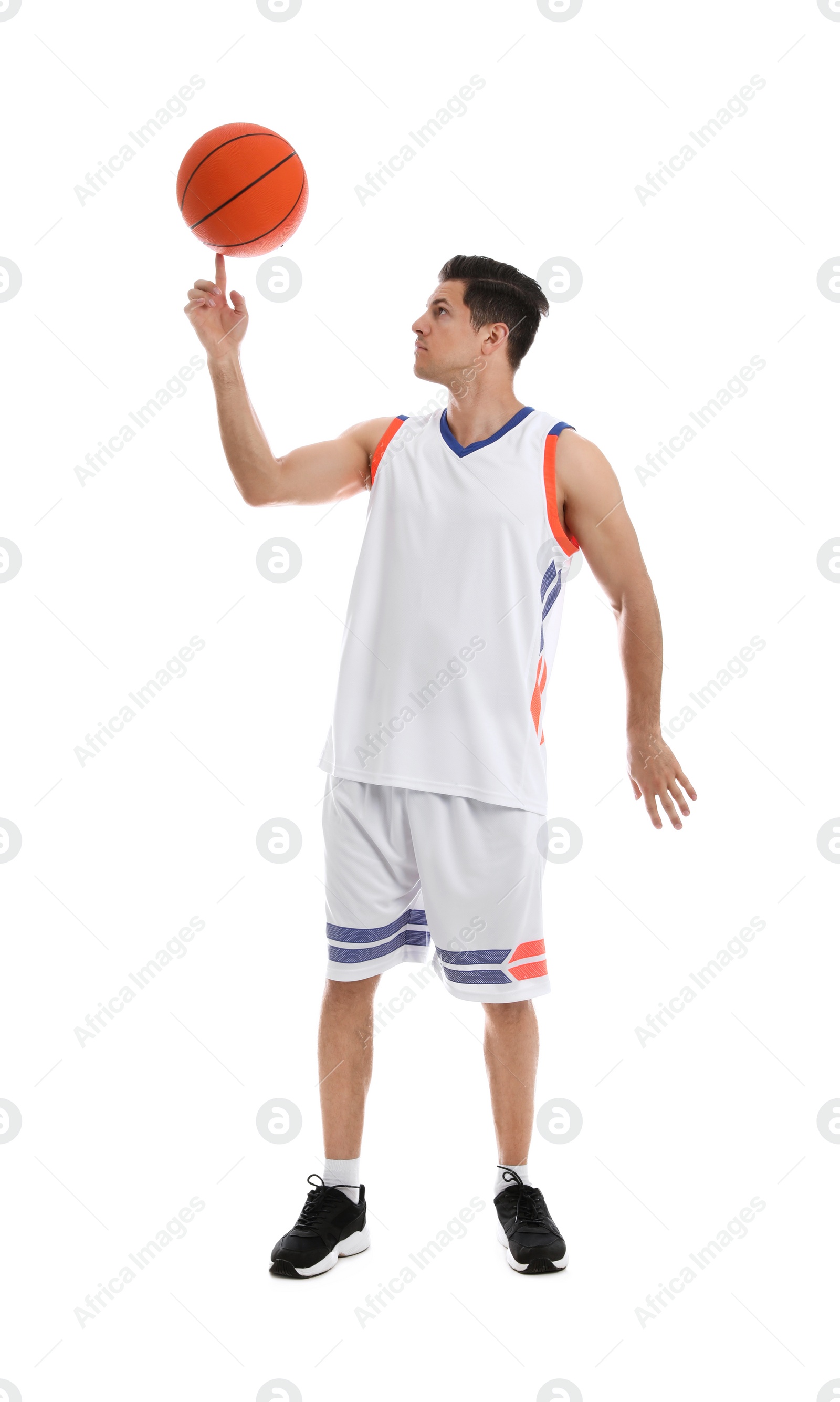 Photo of Basketball player spinning ball on finger against white background