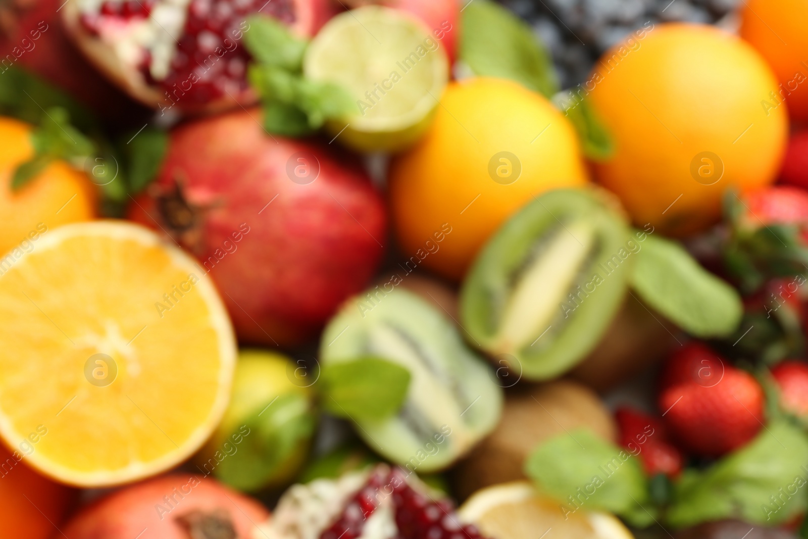 Photo of Many different fruits as background, blurred view