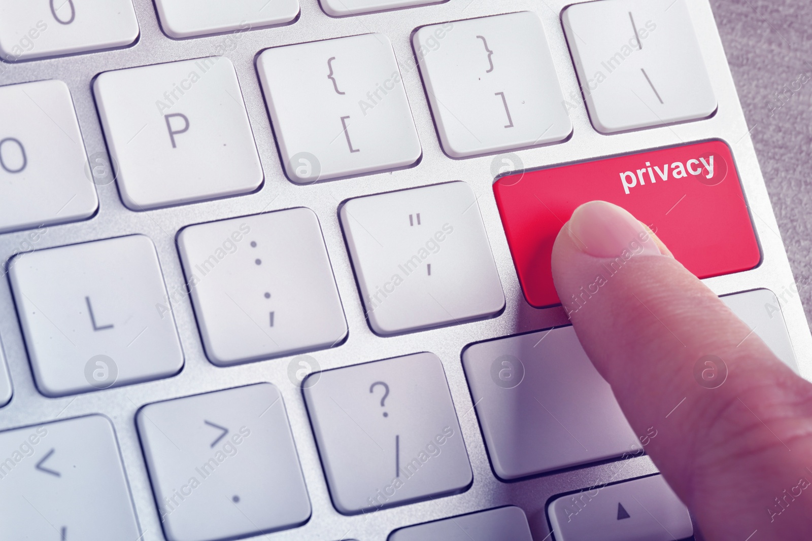 Image of Woman pressing red button with word Privacy on computer keyboard, closeup