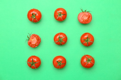 Photo of Flat lay composition with ripe tomatoes on color background