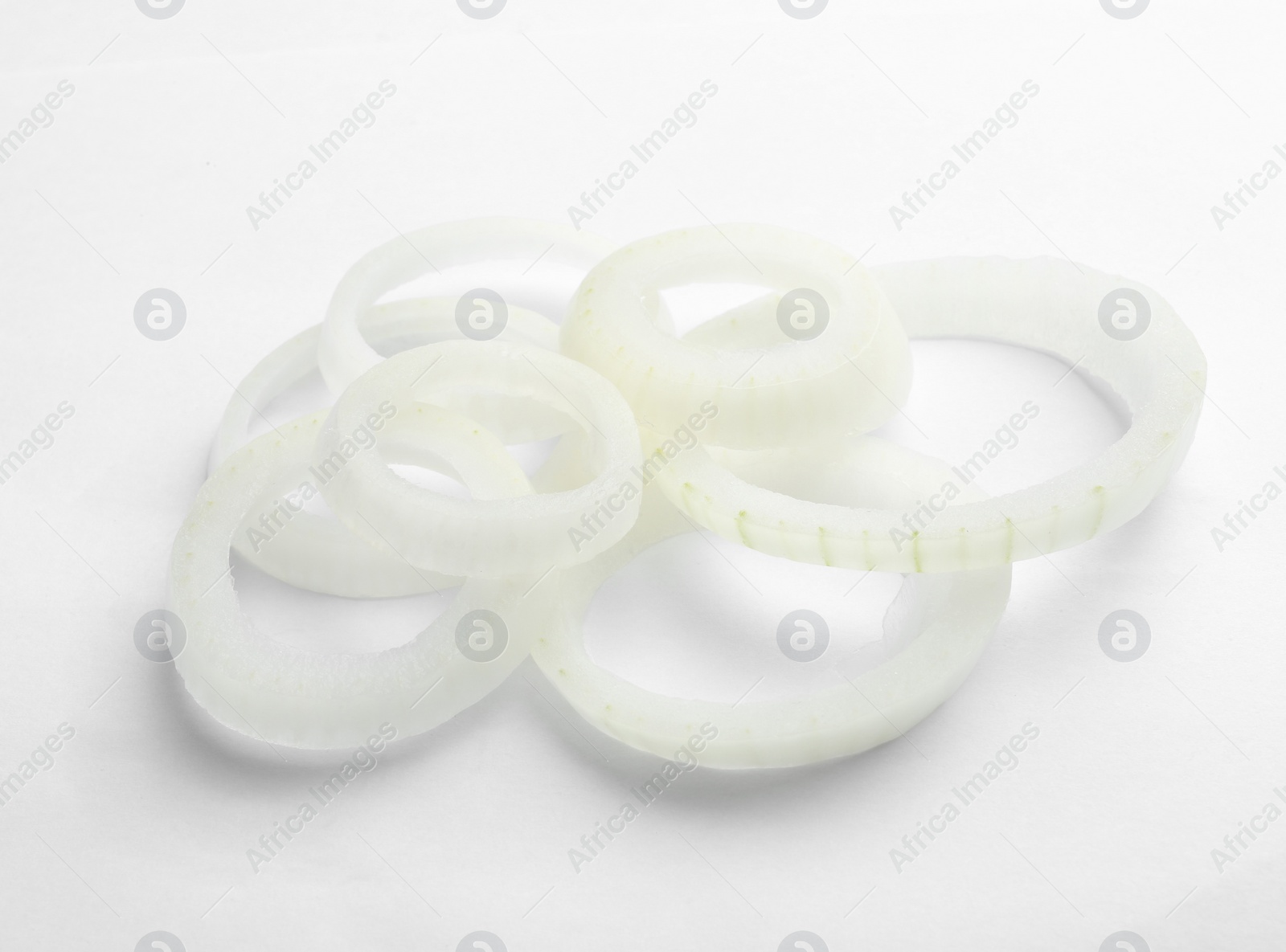 Photo of Fresh raw onion rings on white background