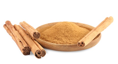 Dry aromatic cinnamon sticks and powder isolated on white