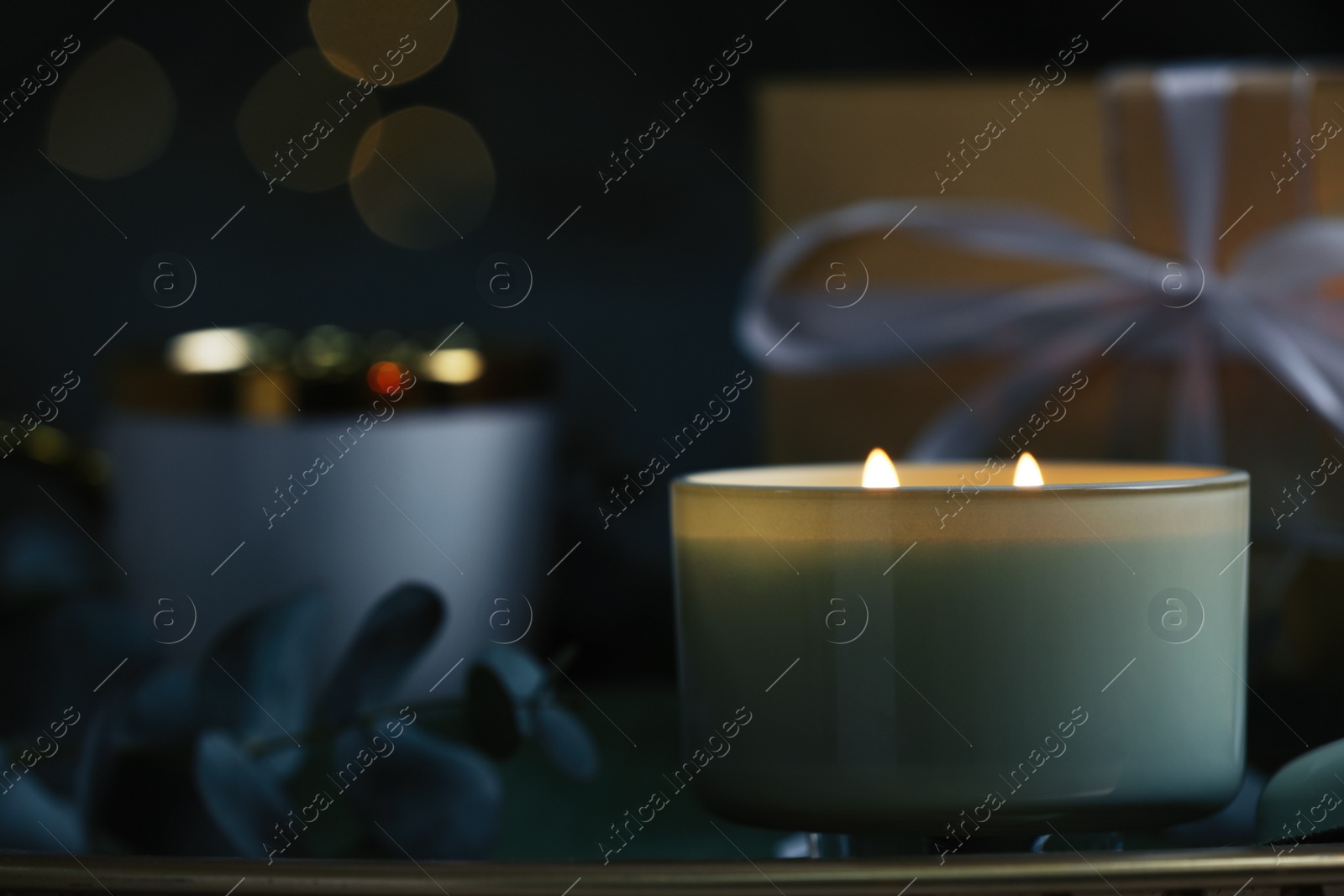 Photo of Beautiful burning candle on table, closeup. Space for text