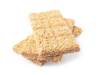 Tasty sesame kozinaki bars on white background