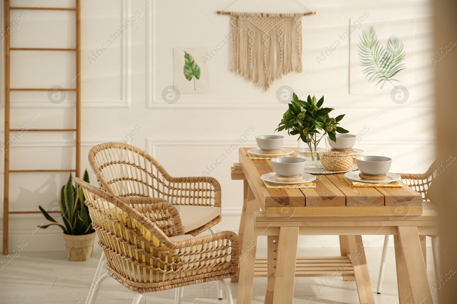 Photo of Stylish wooden dining table and chairs in room. Interior design