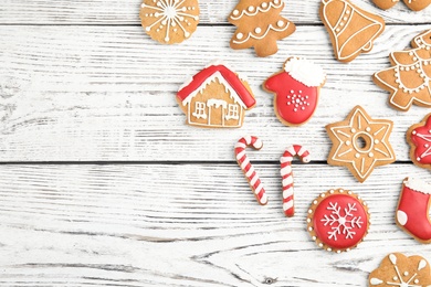 Photo of Tasty homemade Christmas cookies on wooden background, top view