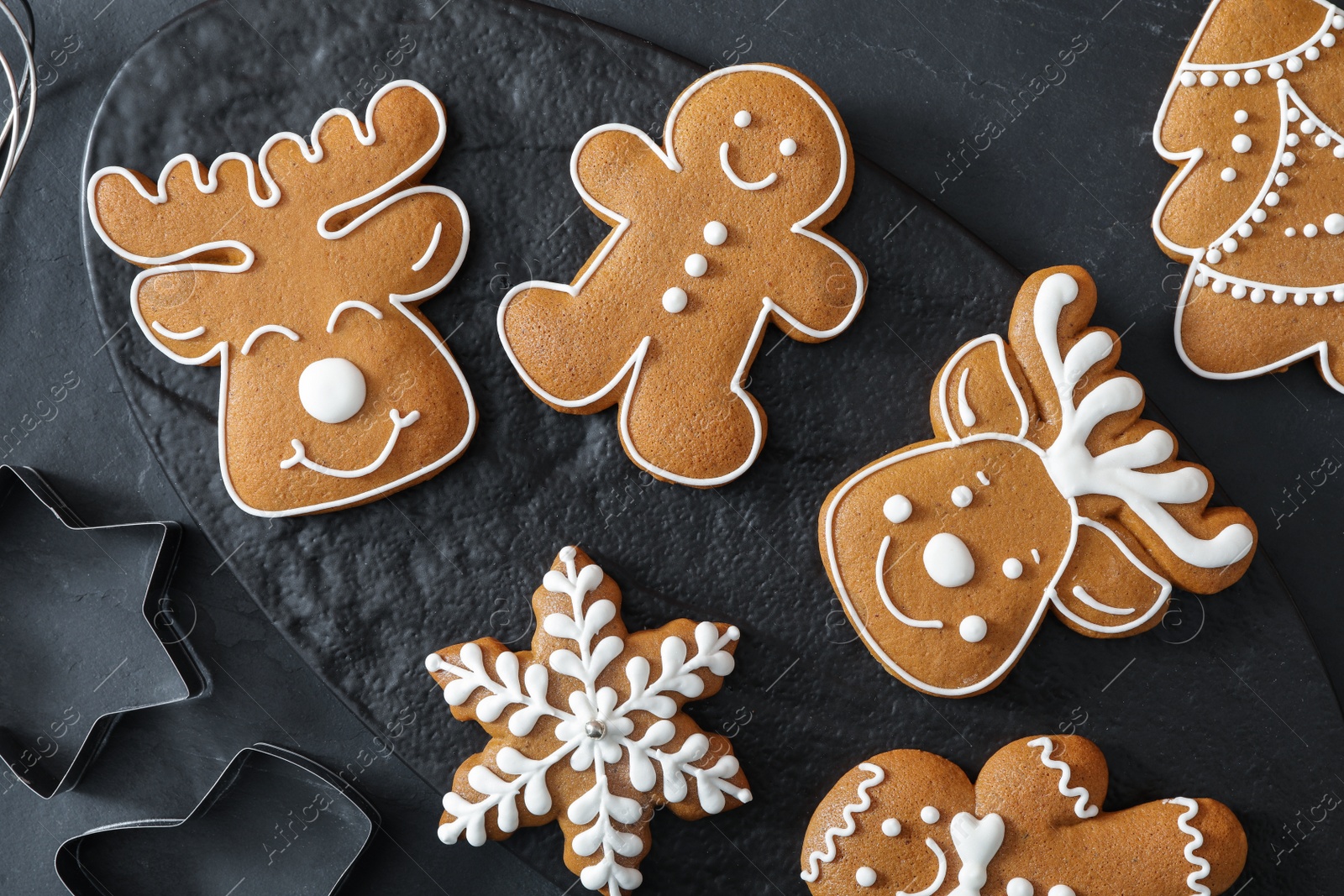 Photo of Flat lay composition with delicious homemade Christmas cookies on black table