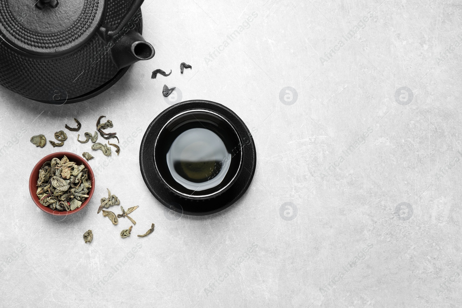 Photo of Flat lay composition with green tea on grey background. Space for text