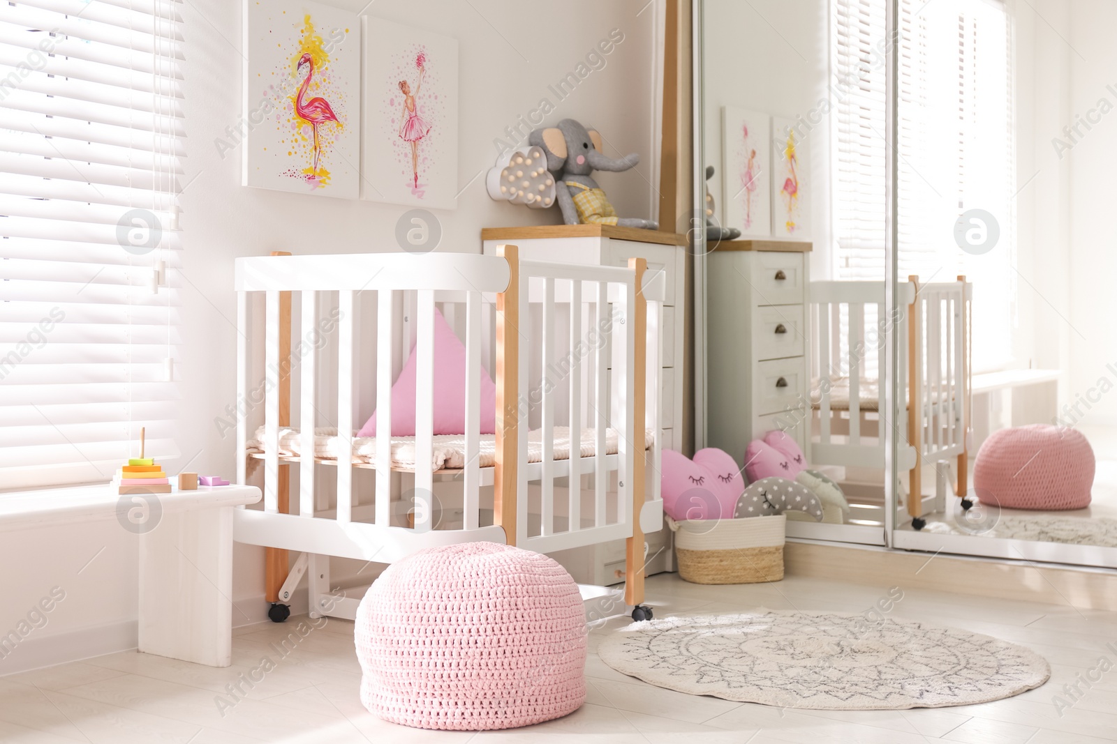 Photo of Baby room interior with beautiful pictures on wall