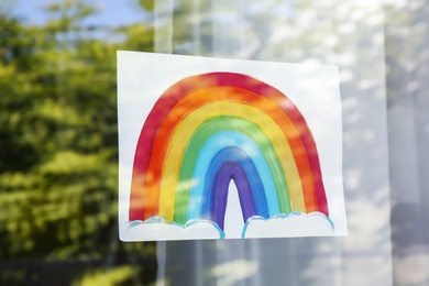 Picture of rainbow on window, view from outdoors, closeup. Stay at home concept