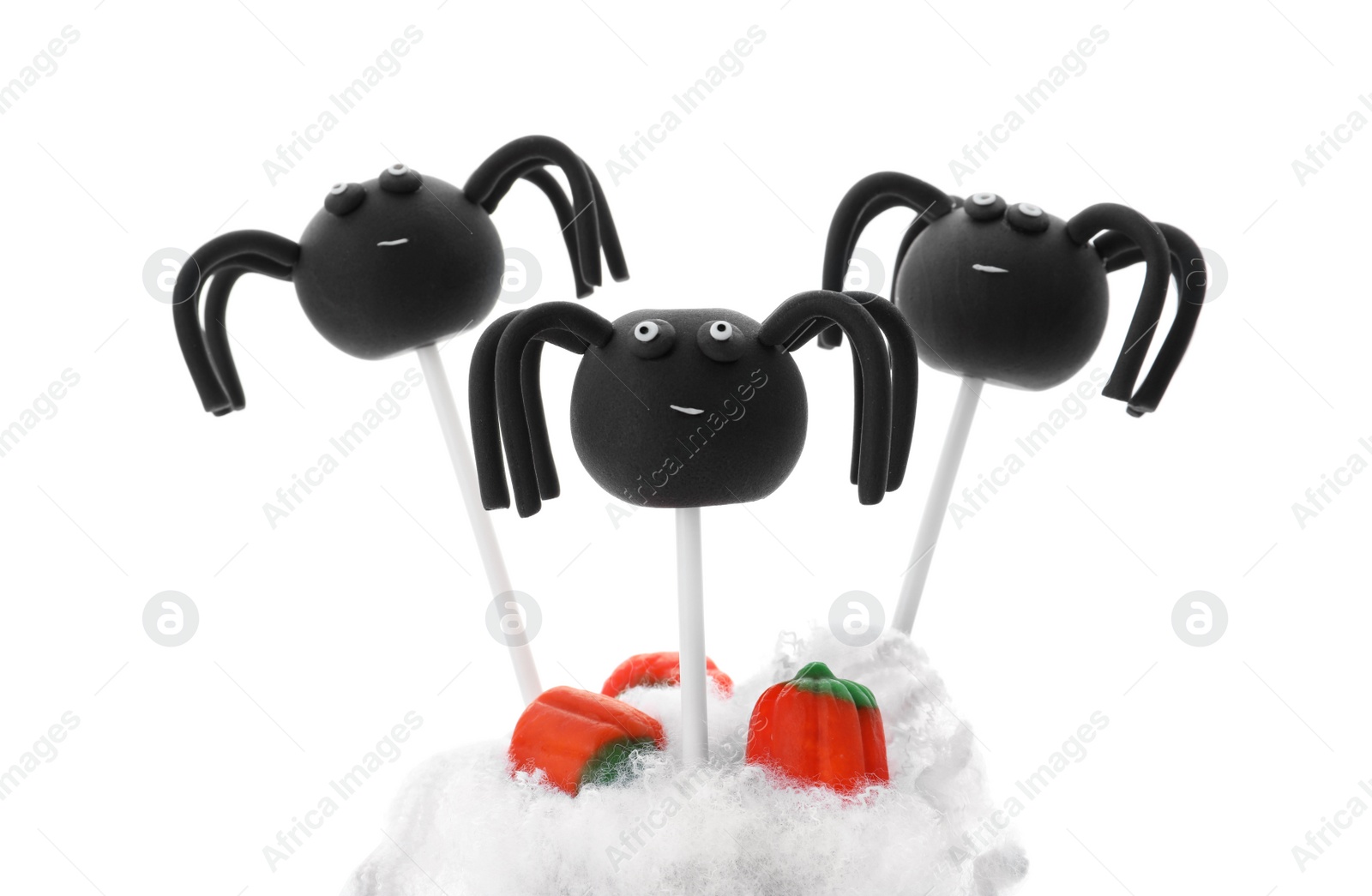 Photo of Delicious spider cake pops on white background. Halloween season