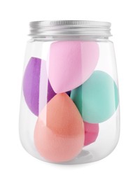 Photo of Jar with makeup sponges isolated on white