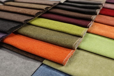 Photo of Fabric samples of different colors as background