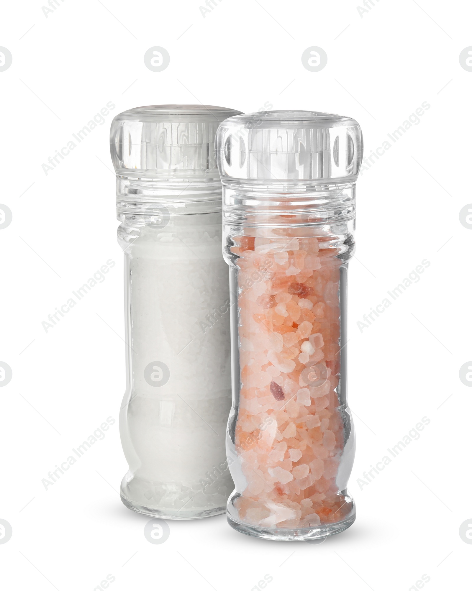 Image of Different salt in glass mill and shaker isolated on white