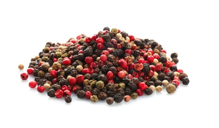 Mix of different pepper grains on white background