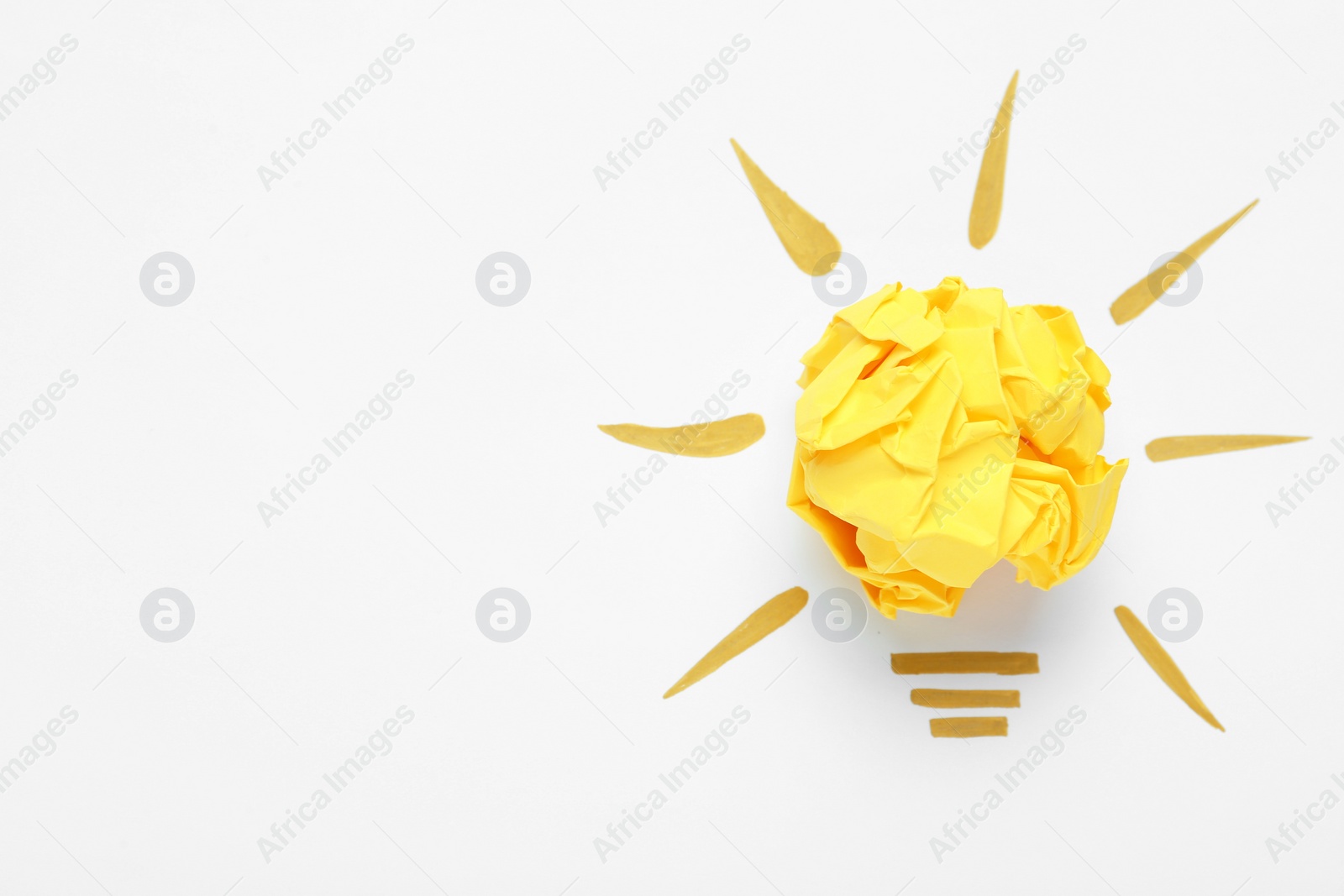 Photo of Creative composition with paper ball as lightbulb on white background, space for text. Idea concept