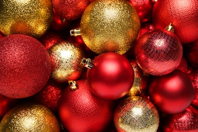 Photo of Red and golden Christmas balls as background, top view