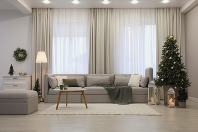 Photo of Elegant living room interior with comfortable sofa and Christmas decor