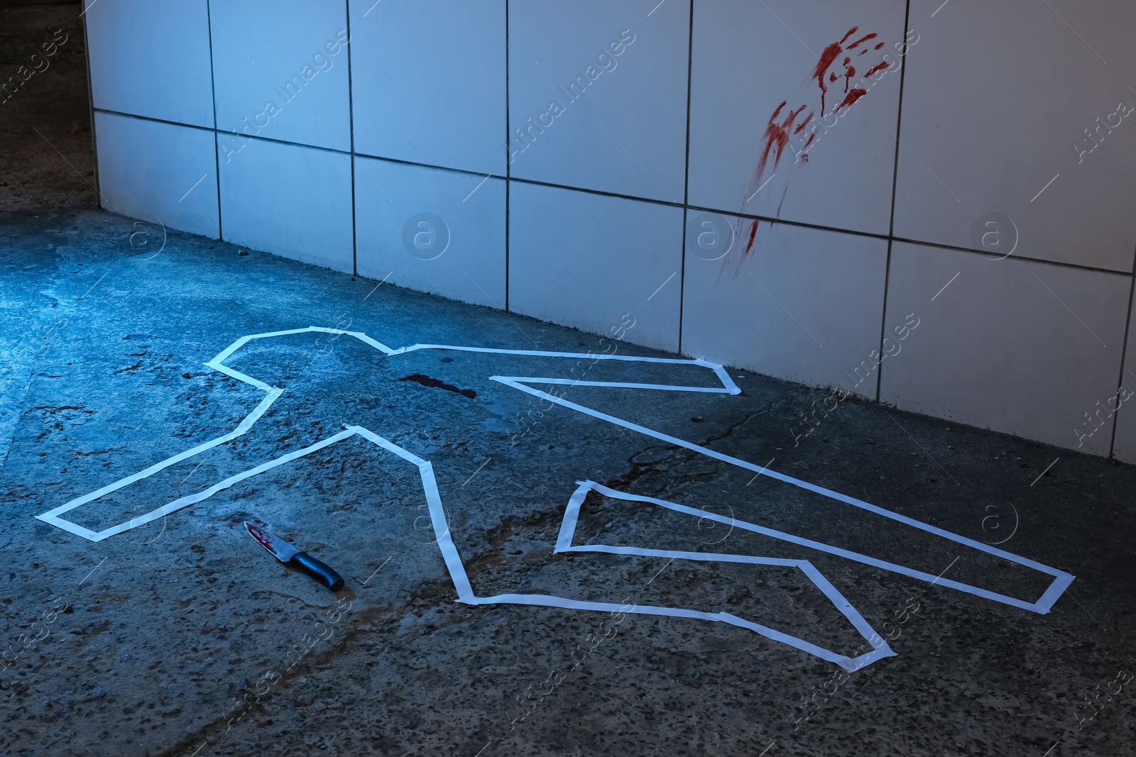 Photo of Crime scene with chalk outline, knife and blood marks on floor. Detective investigation