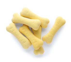 Photo of Bone shaped dog cookies on white background, top view