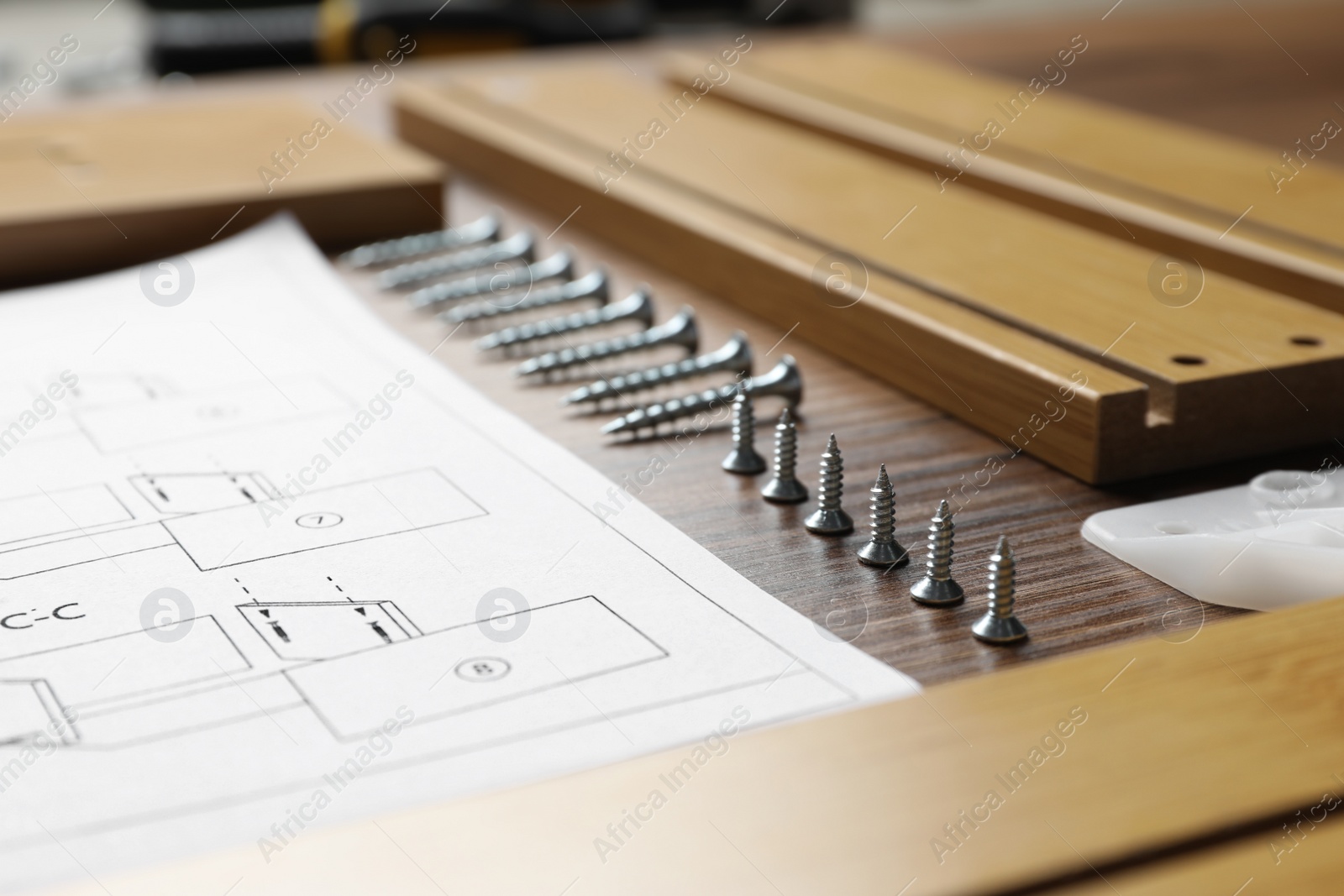 Photo of Composition with furniture parts and tools for self-assembly on wooden background, closeup