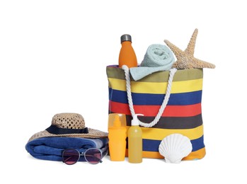 Photo of Stylish bag, starfish and other beach accessories isolated on white