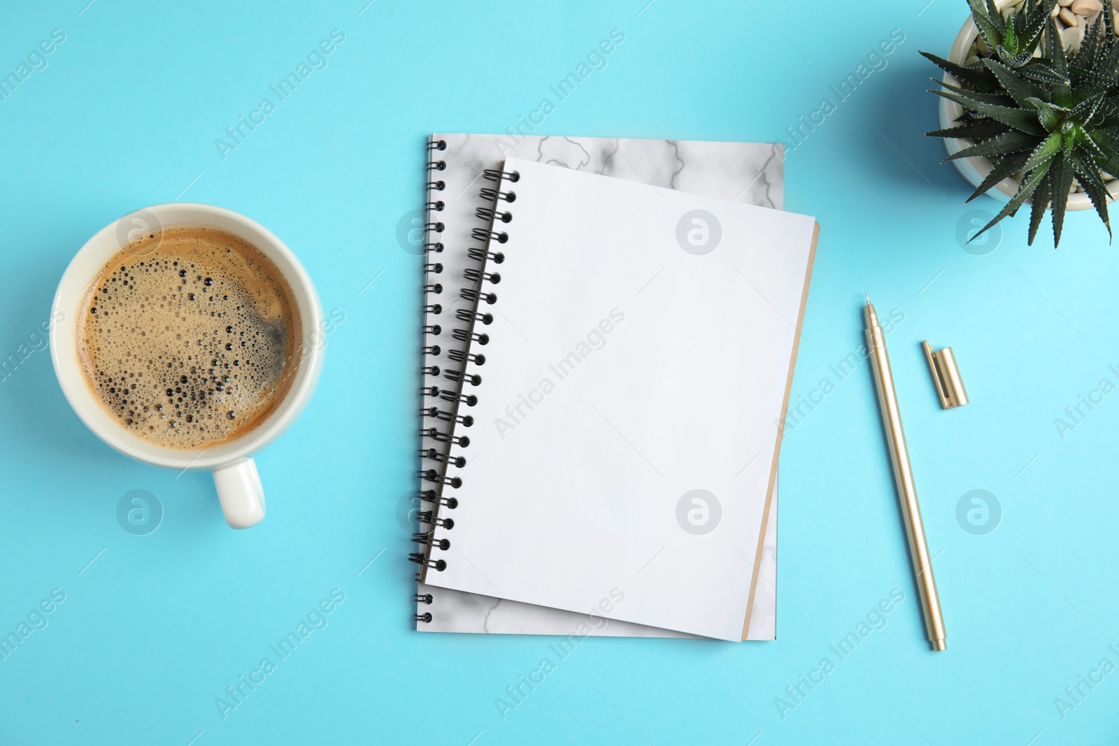 Photo of Flat lay composition with notebooks and coffee on color background