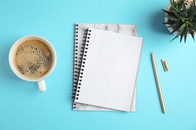 Photo of Flat lay composition with notebooks and coffee on color background