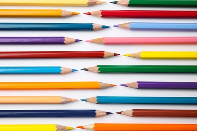 Photo of Composition with color pencils on white background, top view