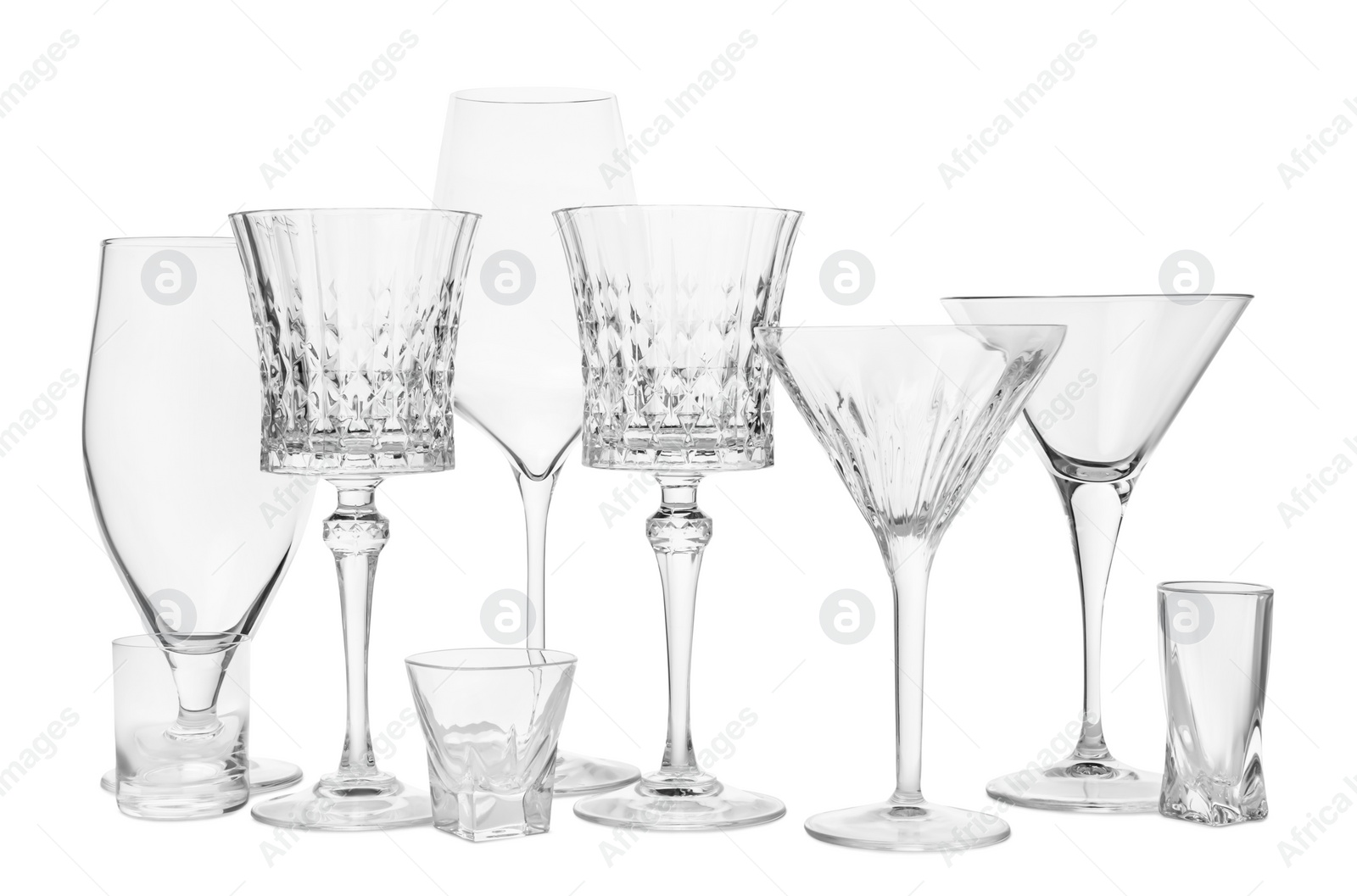 Photo of Different elegant empty glasses isolated on white