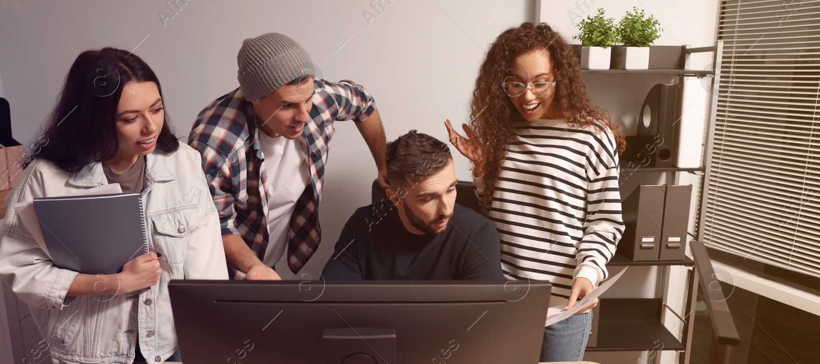 Image of Group of coworkers together in office. Banner design