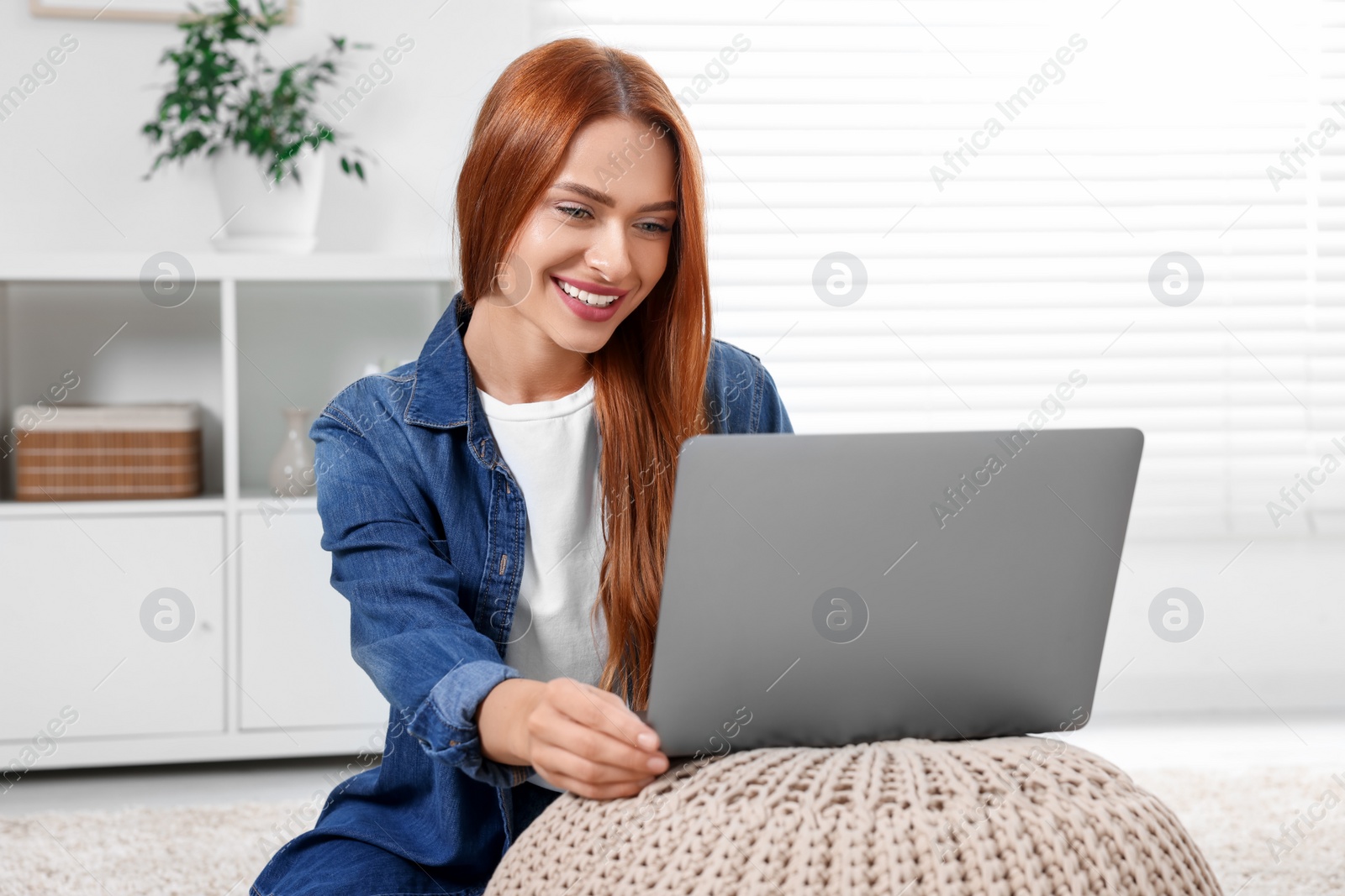 Photo of Woman having video chat via laptop at home