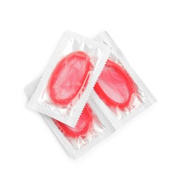 Photo of Condom packages on white background, top view. Safe sex