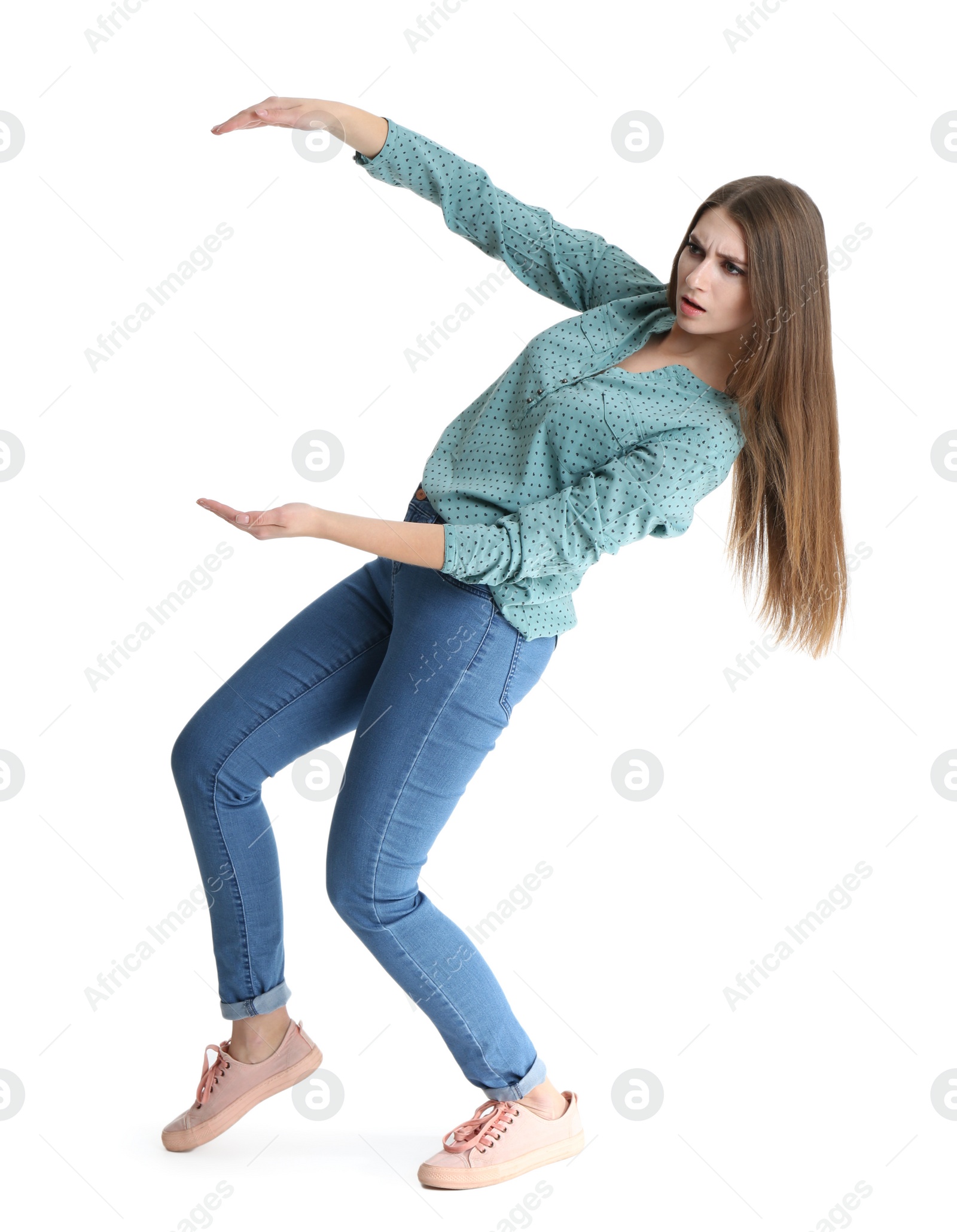 Photo of Young woman with magnet attracting people on white background