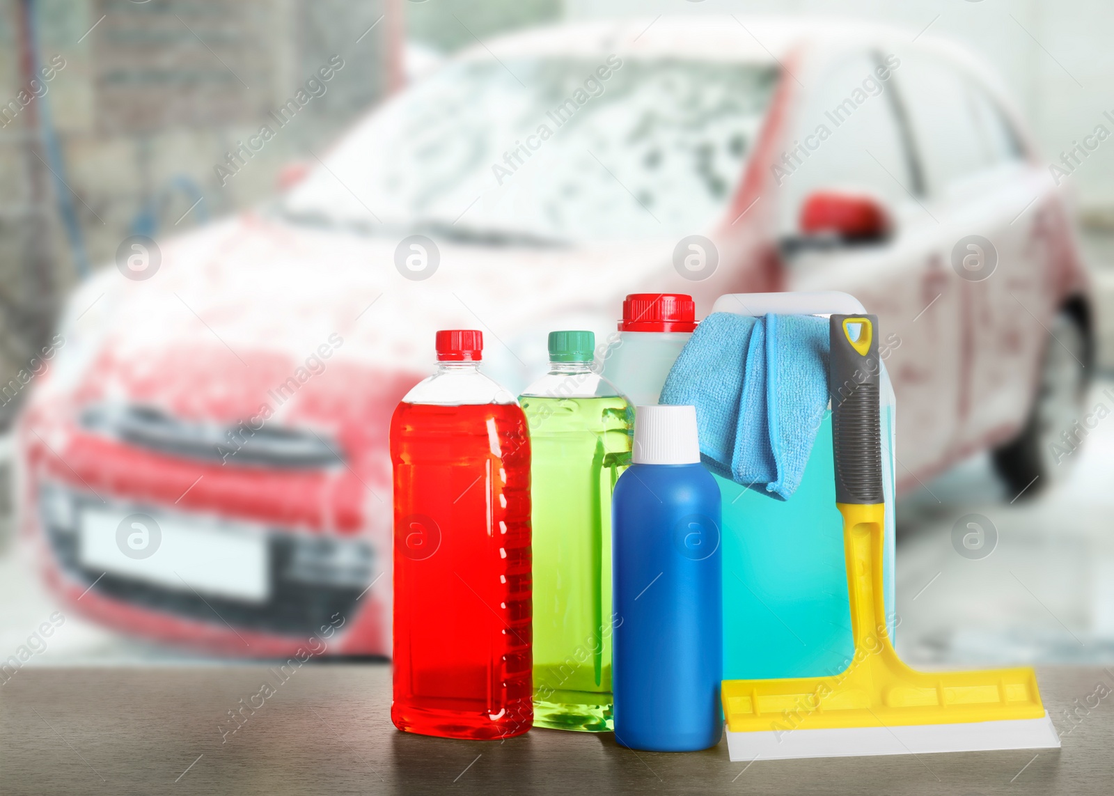 Image of Bucket with cleaning supplies on wooden surface at car wash. Space for text