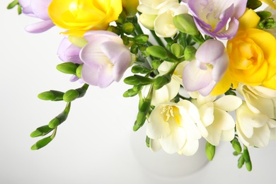 Photo of Bouquet of fresh freesia flowers on white background, closeup