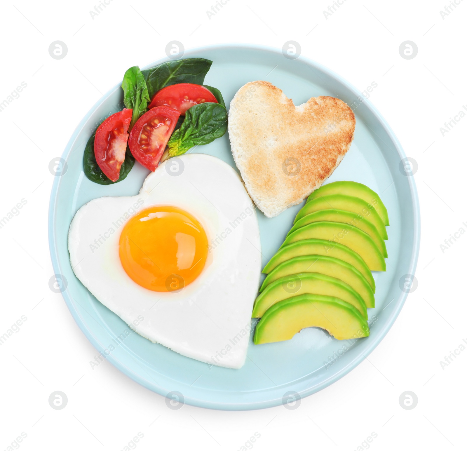 Photo of Romantic breakfast with fried heart shaped egg, avocado and toast isolated on white, top view. Valentine's day celebration