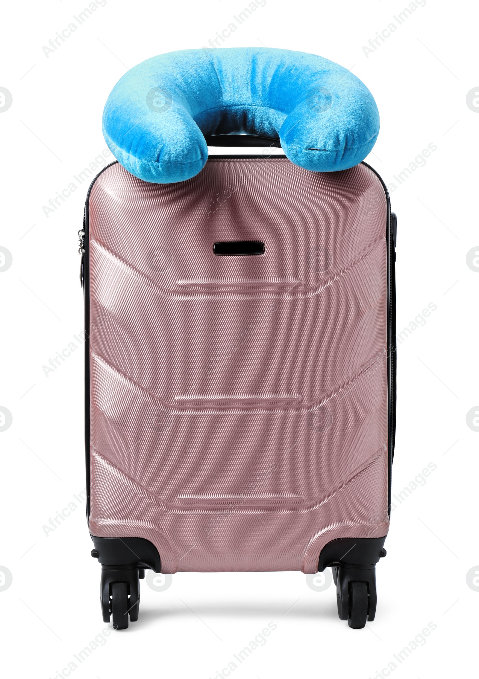 Photo of Soft travel pillow on suitcase isolated on white